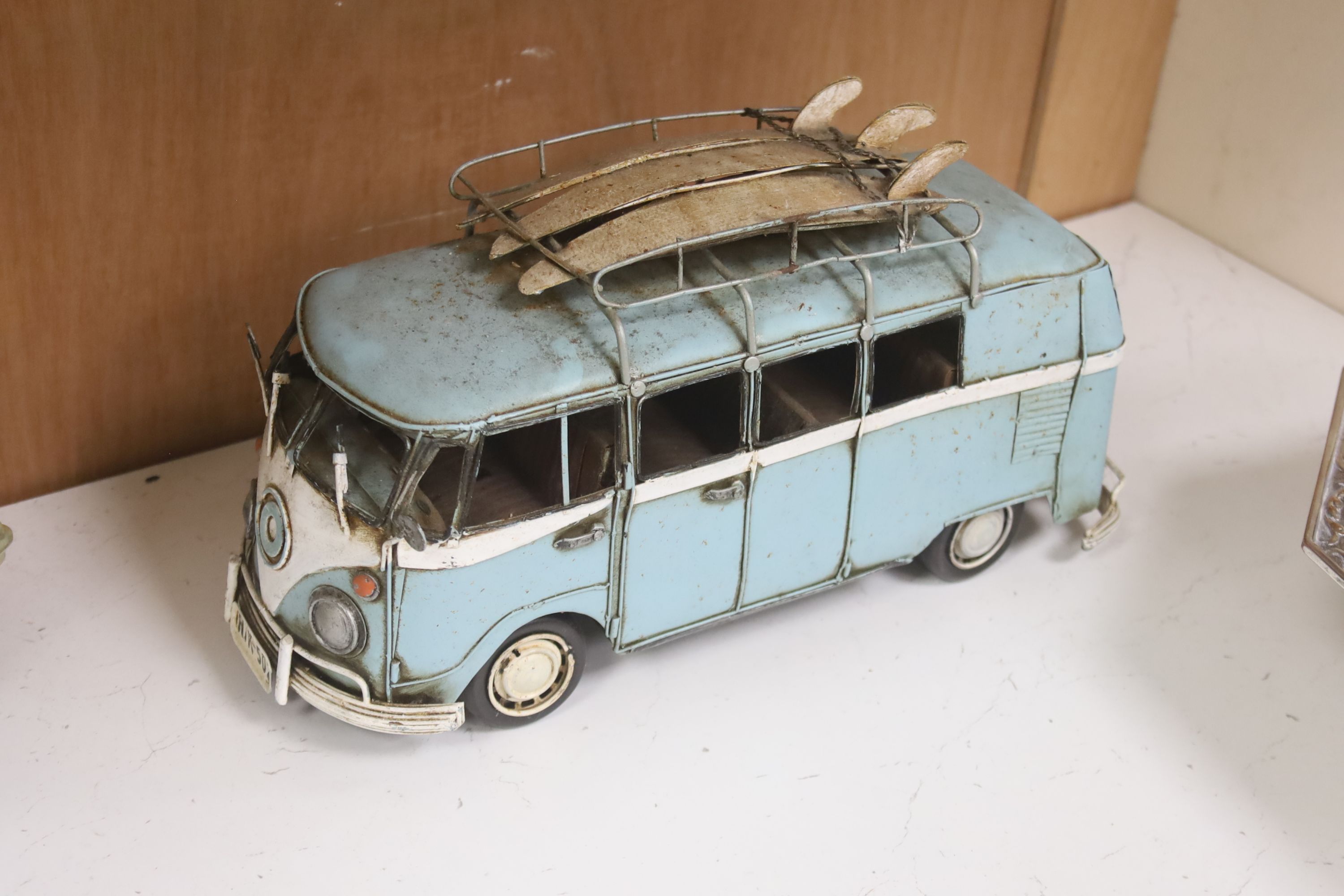 A model of a VW Camper van, a Lambretta and a 1950s Cadalac
